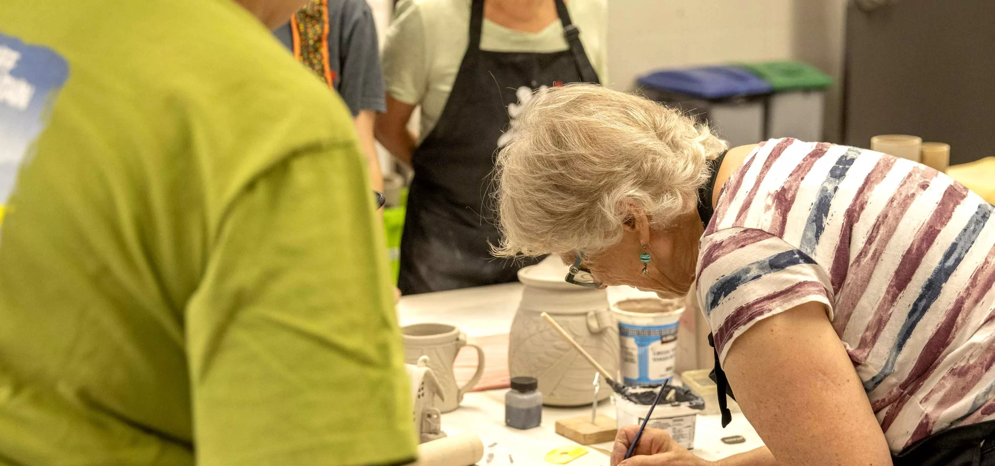 Older females taking part in an art class.